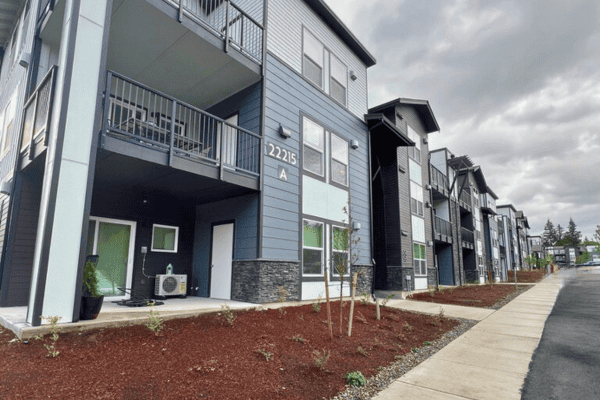 Apartment complex in Kitsap County with clean landscaping, ideal for commercial pet waste removal services.
